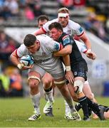 7 October 2023; Dave Ewers of Ulster is tackled by Duncan Weir of Glasgow Warriors during the pre-season friendly match between Ulster and Glasgow Warriors at Kingspan Breffni in Cavan. Photo by Ben McShane/Sportsfile