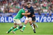 7 October 2023; Scott Cummings of Scotland is tackled by Iain Henderson of Ireland during the 2023 Rugby World Cup Pool B match between Ireland and Scotland at the Stade de France in Paris, France. Photo by Ramsey Cardy/Sportsfile