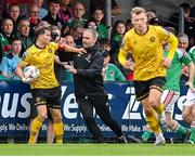 8 October 2023; Anto Breslin of St Patrick's Athletic and Cork City manager Richie Holland tussle over possession of the ball during the Sports Direct Men’s FAI Cup semi-final match between Cork City and St Patrick's Athletic at Turner’s Cross in Cork. Photo by Stephen McCarthy/Sportsfile