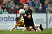 8 October 2023; Sean O'Neill of Erin’s Own Cargin in action against Conal Cunning of Cuchullians Dunloy during the Antrim County Senior Club Football Championship final match between Cuchullians Dunloy and Erin’s Own Cargin at Corrigan Park in Belfast. Photo by Ramsey Cardy/Sportsfile