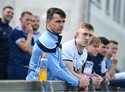 8 October 2023; St Judes players and coaching staff including Danny Sutcliffe, centre, watch the Go-Ahead Dublin Senior 2 Football Semi Final match between Fingallians and Naomh Olaf before the Dublin County Senior Club Football Championship semi-final match between St Judes and Ballyboden St Endas at Parnell Park in Dublin. Photo by Sam Barnes/Sportsfile