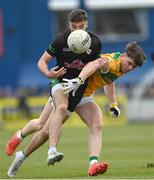 8 October 2023; Benen Kelly of Erin’s Own Cargin in action against Conal Cunning of Cuchullians Dunloy during the Antrim County Senior Club Football Championship final match between Cuchullians Dunloy and Erin’s Own Cargin at Corrigan Park in Belfast. Photo by Ramsey Cardy/Sportsfile