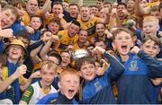 8 October 2023; Summerhill players and supporters celebrate with the Keegan Cup after their side's victory in the Meath County Senior Club Football Championship final match between Summerhill and Ratoath at Páirc Tailteann in Navan, Meath. Photo by Seb Daly/Sportsfile