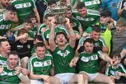 8 October 2023; Mohill captain Shane Quinn lifts the Fenagh Cup as he celebrates with team-mates after their side's victory in the Leitrim County Senior Club Football Championship final match between Mohill and St Mary's Kiltoghert at Avant Money Páirc Seán Mac Diarmada in Carrick-on-Shannon, Leitrim. Photo by Piaras Ó Mídheach/Sportsfile