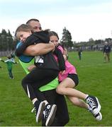 8 October 2023; Mohill manager Eamonn O'Hara celebrates with his nieces Chloe, left, and Ella O'Hara after victory in the Leitrim County Senior Club Football Championship final match between Mohill and St Mary's Kiltoghert at Avant Money Páirc Seán Mac Diarmada in Carrick-on-Shannon, Leitrim. Photo by Piaras Ó Mídheach/Sportsfile