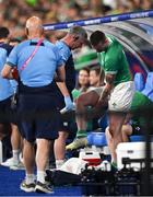7 October 2023; Mack Hansen of Ireland with Ireland team chartered physiotherapist Keith Fox after leaving the pitch with an injury during the 2023 Rugby World Cup Pool B match between Ireland and Scotland at the Stade de France in Paris, France. Photo by Brendan Moran/Sportsfile