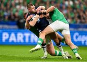 7 October 2023; Finn Russell of Scotland is tackled by Tadhg Furlong and Dan Sheehan of Ireland during the 2023 Rugby World Cup Pool B match between Ireland and Scotland at the Stade de France in Paris, France. Photo by Brendan Moran/Sportsfile