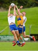 8 October 2023; Ronan Ryan of Summerhill, centre, contests a high ball with Ratoath players Gavin McGowan, left, and Jack Flynn during the Meath County Senior Club Football Championship final match between Summerhill and Ratoath at Páirc Tailteann in Navan, Meath. Photo by Seb Daly/Sportsfile