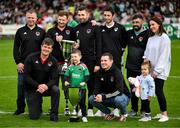 8 October 2023; Cork City amputee team with the Permanent TSB National League title and the David Saunders memorial cup pose for a photograph on the pitch at half-time of the Sports Direct Men’s FAI Cup semi-final match between Cork City and St Patrick's Athletic at Turner’s Cross in Cork. Photo by Stephen McCarthy/Sportsfile