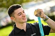9 October 2023; Rhys McClenaghan of Ireland pictured with his gold medal on his return at Dublin Airport after winning in the Men's Pommel Horse Final at the 2023 World Artistic Gymnastics Championships. Photo by Ramsey Cardy/Sportsfile