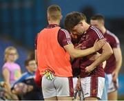 7 October 2023; Sean Grenham of Raheny is consoled by team mates after the penalty shoot-out in the Dublin County Senior Club Championship Football Semi-Final match between Kilmacud Crokes and Raheny at Parnell Park in Dublin. Photo by Stephen Marken/Sportsfile