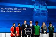 10 October 2023; The joint bid of England, Republic of Ireland, Northern Ireland, Scotland and Wales have been announced as the hosts for UEFA EURO 2028. On stage is former Wales international player Gareth Bale, third from left, and UEFA President Aleksander Ceferin, centre, with representatives from the host countries, including Shamrock Rovers player and Republic of Ireland underage international Ade Solanke, third from right, during the UEFA EURO 2028 & 2032 Host Announcement at the UEFA headquarters, in Nyon, Switzerland. Photo by Kristian Skeie/UEFA via Sportsfile