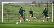 10 October 2023; Andrew Omobamidele with Jayson Molumby, centre, and Mikey Johnston, right, during a Republic of Ireland training session at the FAI National Training Centre in Abbotstown, Dublin. Photo by Stephen McCarthy/Sportsfile