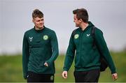 10 October 2023; Evan Ferguson accompanied by Kieran Crowley, FAI communications manager, makes his way to a press conference following a Republic of Ireland training session at the FAI National Training Centre in Abbotstown, Dublin. Photo by Stephen McCarthy/Sportsfile