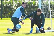 12 October 2023; Goalkeeper Mark Travers and Jason Knight, left, during a Republic of Ireland training session at the FAI National Training Centre in Abbotstown, Dublin. Photo by Stephen McCarthy/Sportsfile