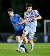 12 October 2023; James Clarke of Bohemians in action against Dara Keane of UCD during the SSE Airtricity Men's Premier Division match between UCD and Bohemians at UCD Bowl in Dublin. Photo by Ben McShane/Sportsfile