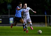 12 October 2023; Evan Osam of UCD in action against Danny Grant of Bohemians during the SSE Airtricity Men's Premier Division match between UCD and Bohemians at UCD Bowl in Dublin. Photo by Ben McShane/Sportsfile