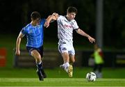 12 October 2023; James Clarke of Bohemians in action against Dara Keane of UCD during the SSE Airtricity Men's Premier Division match between UCD and Bohemians at UCD Bowl in Dublin. Photo by Ben McShane/Sportsfile