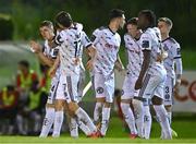 12 October 2023; James Clarke of Bohemians, hidden, celebrates with teammates after scoring their side's first goal during the SSE Airtricity Men's Premier Division match between UCD and Bohemians at UCD Bowl in Dublin. Photo by Ben McShane/Sportsfile
