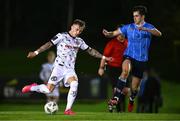 12 October 2023; Danny Grant of Bohemians in action against Adam Verdon of UCD during the SSE Airtricity Men's Premier Division match between UCD and Bohemians at UCD Bowl in Dublin. Photo by Ben McShane/Sportsfile