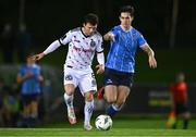12 October 2023; Ali Coote of Bohemians in action against Adam Verdon of UCD during the SSE Airtricity Men's Premier Division match between UCD and Bohemians at UCD Bowl in Dublin. Photo by Ben McShane/Sportsfile