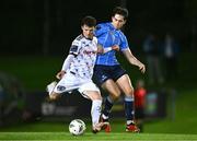 12 October 2023; Ali Coote of Bohemians in action against Adam Verdon of UCD during the SSE Airtricity Men's Premier Division match between UCD and Bohemians at UCD Bowl in Dublin. Photo by Ben McShane/Sportsfile