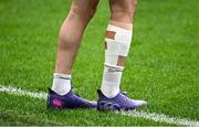 13 October 2023; A detailed view of strapping on the leg of Mack Hansen during an Ireland Rugby captain's run at the Stade de France in Paris, France. Photo by Harry Murphy/Sportsfile