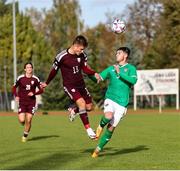 13 October 2023; James Furlong of Republic of Ireland in action against Jegors Novikovs of Latvia during the UEFA European U21 Championship qualifying group A match between Latvia and Republic of Ireland at the Zemgales Olympic Centre in Jelgava, Latvia. Photo by Gerry Scully/Sportsfile