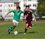 13 October 2023; Tony Springett of Republic of Ireland in action against Ralf Maslovs of Latvia during the UEFA European U21 Championship qualifying group A match between Latvia and Republic of Ireland at the Zemgales Olympic Centre in Jelgava, Latvia. Photo by Gerry Scully/Sportsfile