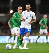 13 October 2023; Dimitris Kourbelis of Greece in action against Will Smallbone of Republic of Ireland during the UEFA EURO 2024 Championship qualifying group B match between Republic of Ireland and Greece at the Aviva Stadium in Dublin. Photo by Stephen McCarthy/Sportsfile