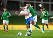 13 October 2023; Kostas Tsimikas of Greece in action against Alan Browne of Republic of Ireland during the UEFA EURO 2024 Championship qualifying group B match between Republic of Ireland and Greece at the Aviva Stadium in Dublin. Photo by Stephen McCarthy/Sportsfile