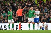 13 October 2023; Will Smallbone of Republic of Ireland receives a yellow card from referee Glenn Nyberg during the UEFA EURO 2024 Championship qualifying group B match between Republic of Ireland and Greece at the Aviva Stadium in Dublin. Photo by Stephen McCarthy/Sportsfile