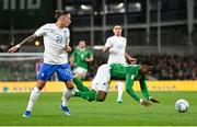 13 October 2023; Chiedozie Ogbene of Republic of Ireland in action against Kostas Tsimikas of Greece during the UEFA EURO 2024 Championship qualifying group B match between Republic of Ireland and Greece at the Aviva Stadium in Dublin. Photo by Stephen McCarthy/Sportsfile