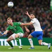 13 October 2023; Liam Scales of Republic of Ireland in action against Giorgos Masouras of Greece during the UEFA EURO 2024 Championship qualifying group B match between Republic of Ireland and Greece at the Aviva Stadium in Dublin. Photo by Stephen McCarthy/Sportsfile
