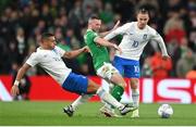 13 October 2023; Alan Browne of Republic of Ireland in action against Giorgos Giakoumakis, left, and Dimitris Pelkas of Greece during the UEFA EURO 2024 Championship qualifying group B match between Republic of Ireland and Greece at the Aviva Stadium in Dublin. Photo by Seb Daly/Sportsfile