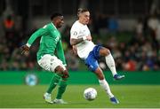 13 October 2023; Kostas Tsimikas of Greece in action against Chiedozie Ogbene of Republic of Ireland during the UEFA EURO 2024 Championship qualifying group B match between Republic of Ireland and Greece at the Aviva Stadium in Dublin. Photo by Michael P Ryan/Sportsfile