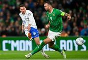 13 October 2023; Tasos Chatzigiovanis of Greece in action against Shane Duffy of Republic of Ireland during the UEFA EURO 2024 Championship qualifying group B match between Republic of Ireland and Greece at the Aviva Stadium in Dublin. Photo by Tyler Miller/Sportsfile