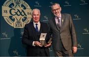 13 October 2023; Liam Ó Donnchú is presented with the 2021 MacNamee Best GAA Publication Award by Uachtarán Chumann Lúthchleas Gael Larry McCarthy during the GAA MacNamee Awards 2021 & 2022 at Cusack Suite in Croke Park, Dublin. Photo by David Fitzgerald/Sportsfile *** NO REPRODUCTION FEE ***