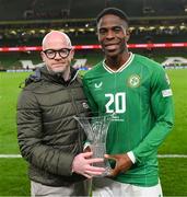 13 October 2023; Chiedozie Ogbene of Republic of Ireland is presented with the Carlsberg Player of the Match award by Shane Kelly, Public Relations Director for Diageo Ireland, after the UEFA EURO 2024 Championship qualifying group B match between Republic of Ireland and Greece at the Aviva Stadium in Dublin. Photo by Stephen McCarthy/Sportsfile