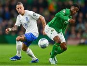 13 October 2023; Kostas Tsimikas of Greece in action against Chiedozie Ogbene of Republic of Ireland during the UEFA EURO 2024 Championship qualifying group B match between Republic of Ireland and Greece at the Aviva Stadium in Dublin. Photo by Tyler Miller/Sportsfile