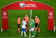13 October 2023; Captains Shane Duffy of Republic of Ireland and Tasos Bakasetas of Greece shake hands as referee Glenn Nyberg, Assistant referee Mahbod Beigi and Assistant referee Andreas Söderqvist look on during the UEFA EURO 2024 Championship qualifying group B match between Republic of Ireland and Greece at the Aviva Stadium in Dublin. Photo by Sam Barnes/Sportsfile
