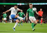 13 October 2023; Giorgos Masouras of Greece in action against Liam Scales of Republic of Ireland during the UEFA EURO 2024 Championship qualifying group B match between Republic of Ireland and Greece at the Aviva Stadium in Dublin. Photo by Michael P Ryan/Sportsfile