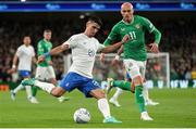 13 October 2023; Petros Mantalos of Greece in action against Will Smallbone of Republic of Ireland during the UEFA EURO 2024 Championship qualifying group B match between Republic of Ireland and Greece at the Aviva Stadium in Dublin. Photo by Michael P Ryan/Sportsfile