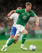 13 October 2023; Nathan Collins of Republic of Ireland in action against Tasos Bakasetas of Greece during the UEFA EURO 2024 Championship qualifying group B match between Republic of Ireland and Greece at the Aviva Stadium in Dublin. Photo by Michael P Ryan/Sportsfile