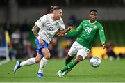 13 October 2023; Kostas Tsimikas of Greece in action against Chiedozie Ogbene of Republic of Ireland during the UEFA EURO 2024 Championship qualifying group B match between Republic of Ireland and Greece at the Aviva Stadium in Dublin. Photo by Stephen McCarthy/Sportsfile