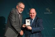 13 October 2023; Brendan Ó Dufaigh is presented with the 2022 Gradam na Gaeilge by Uachtarán Chumann Lúthchleas Gael Larry McCarthy during the GAA MacNamee Awards 2021 & 2022 at Cusack Suite in Croke Park, Dublin. Photo by Ray McManus/Sportsfile