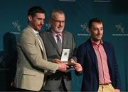 13 October 2023; Seán Ó Cuirrín and Colm Ó Neasa are presented with the Gradam na Gaeilge Award by Uachtarán Chumann Lúthchleas Gael Larry McCarthy during the GAA MacNamee Awards 2021 & 2022 at Cusack Suite in Croke Park, Dublin. Photo by Ray McManus/Sportsfile