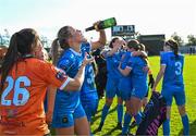 14 October 2023; Chloe Moloney of Peamount United celebrates with champagne after claiming the title after victory in the SSE Airtricity Women's Premier Division match between Wexford Youths and Peamount United at Ferrycarrig Park in Wexford. Photo by Piaras Ó Mídheach/Sportsfile