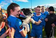 14 October 2023; Jetta Berrill of Peamount United celebrates with her dog Lucy after claiming the title after victory in the SSE Airtricity Women's Premier Division match between Wexford Youths and Peamount United at Ferrycarrig Park in Wexford. Photo by Piaras Ó Mídheach/Sportsfile