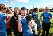 14 October 2023; Jetta Berrill of Peamount United celebrates with her dog with Lucy after claiming the title after victory in the SSE Airtricity Women's Premier Division match between Wexford Youths and Peamount United at Ferrycarrig Park in Wexford. Photo by Piaras Ó Mídheach/Sportsfile